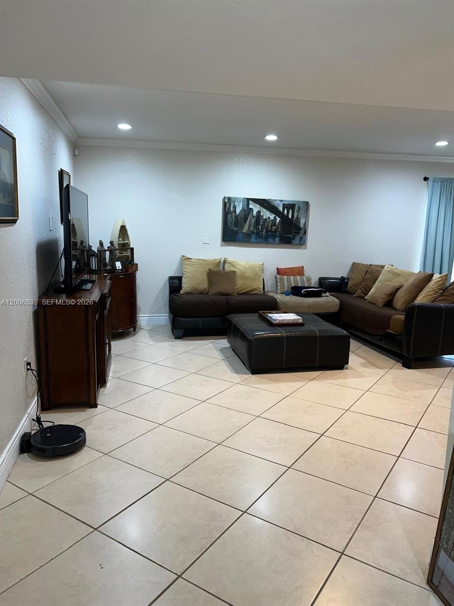 11600 Southwest 83rd Terrace Miami, FL 33173 - Photo 9 of 21 a living room with furniture and a flat screen tv