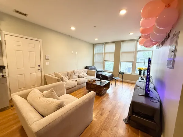 a living room with furniture and a large window