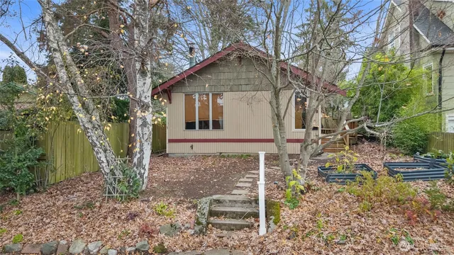 a front view of a house with garden