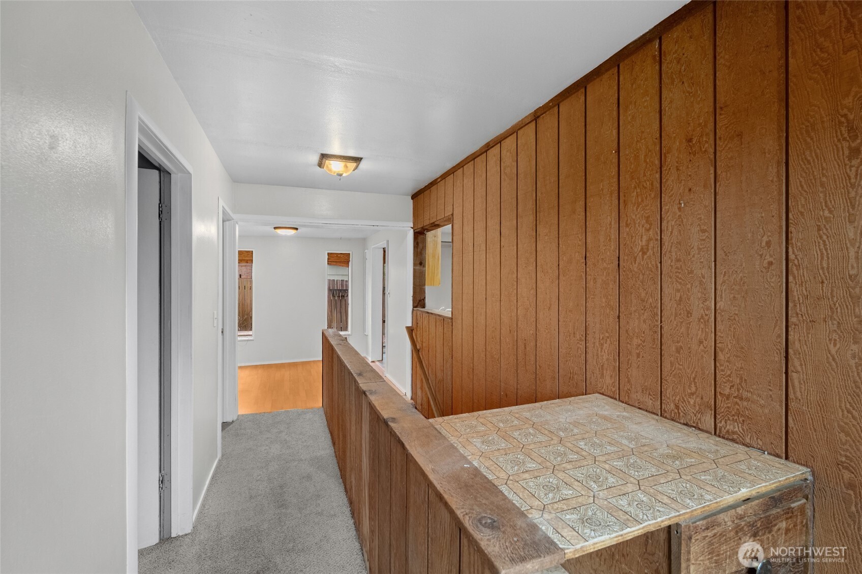 4338 Southwest Willow Street Seattle, WA 98136 - Photo 14 of 30 a view of a hallway with wooden floor