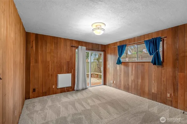 a view of a room with a large window and closet