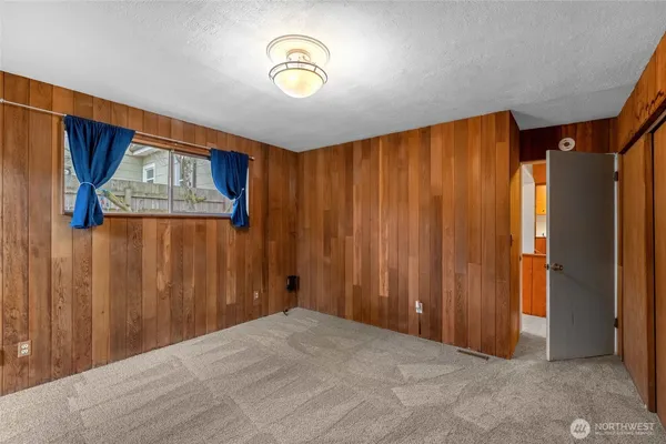 a view of a hallway with a wooden door