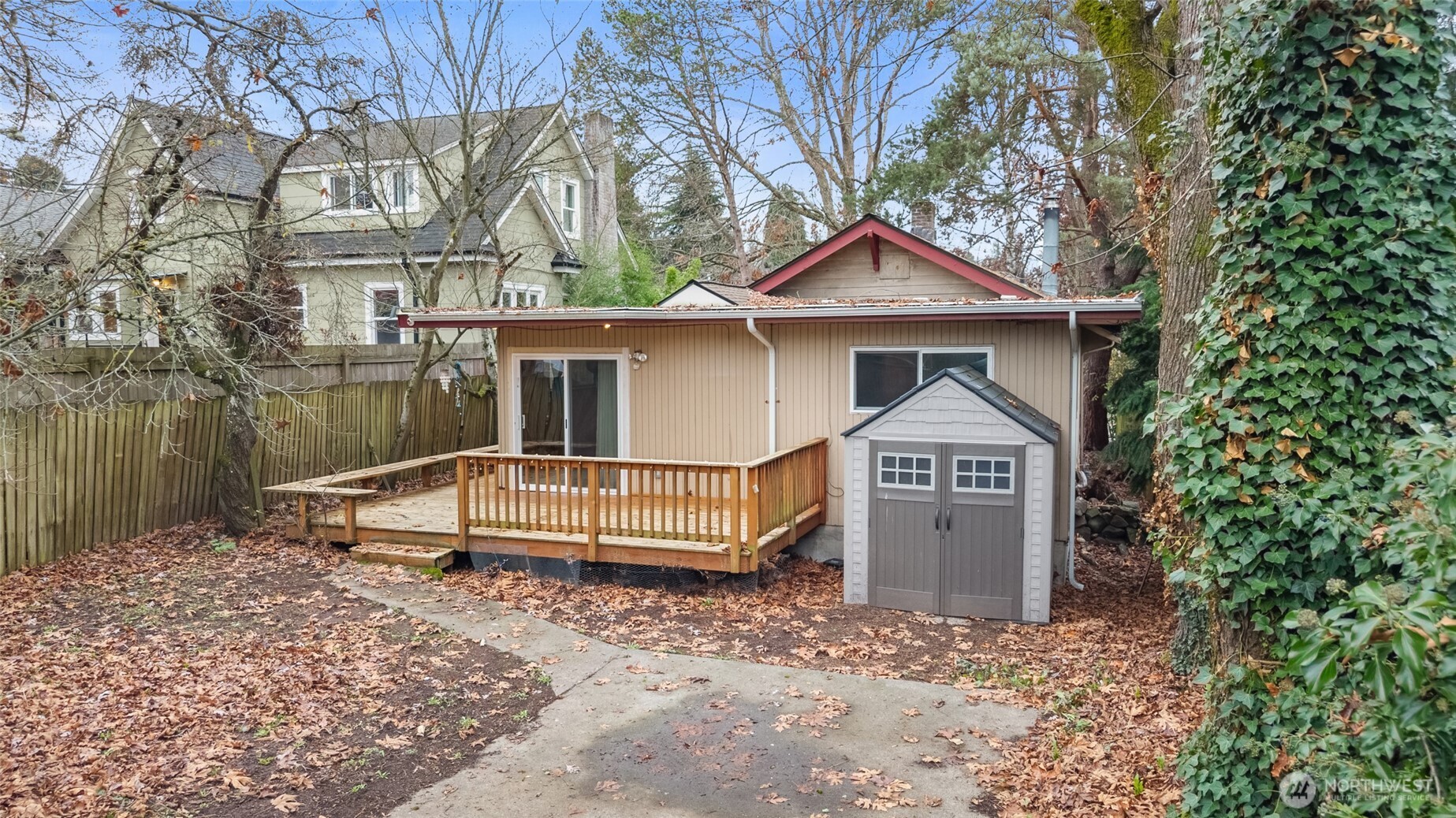 4338 Southwest Willow Street Seattle, WA 98136 - Photo 21 of 30 a front view of a house with a yard and garage