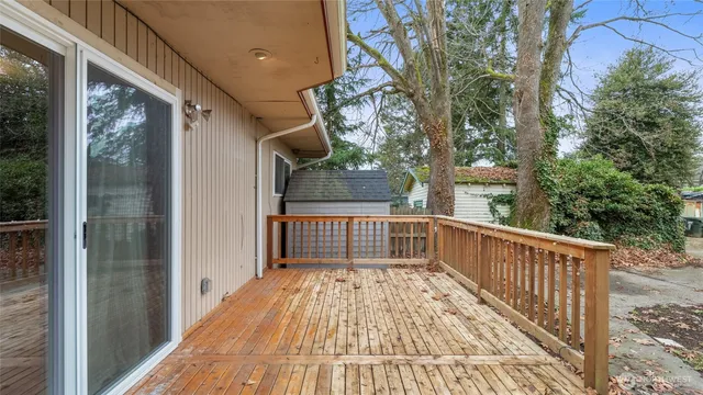 a view of balcony with wooden floor and lake view