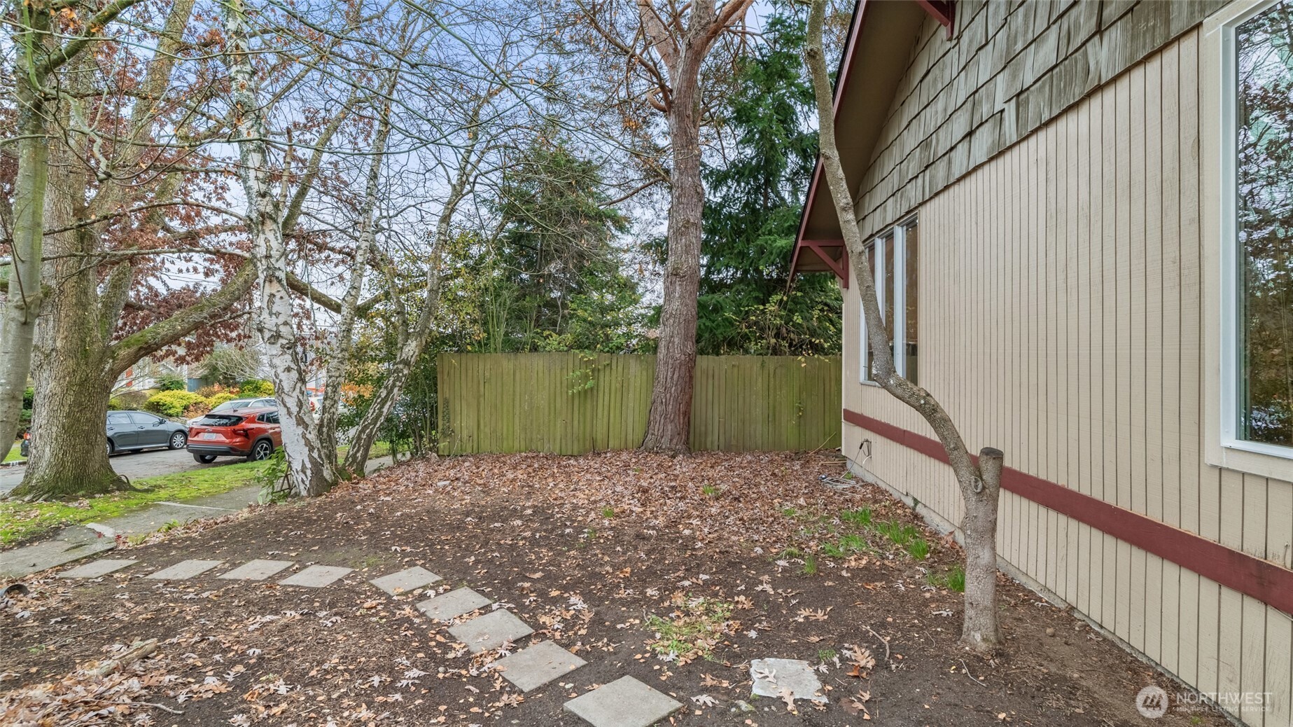 4338 Southwest Willow Street Seattle, WA 98136 - Photo 26 of 30 a view of a house with a yard