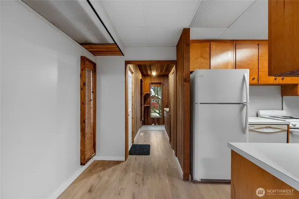 a view of a kitchen from the hallway