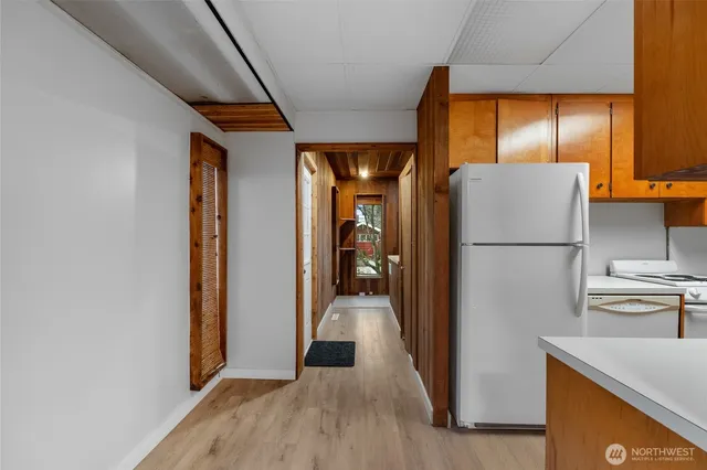 a view of a kitchen from the hallway