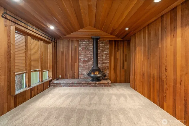 a view of a room with wooden walls and roof