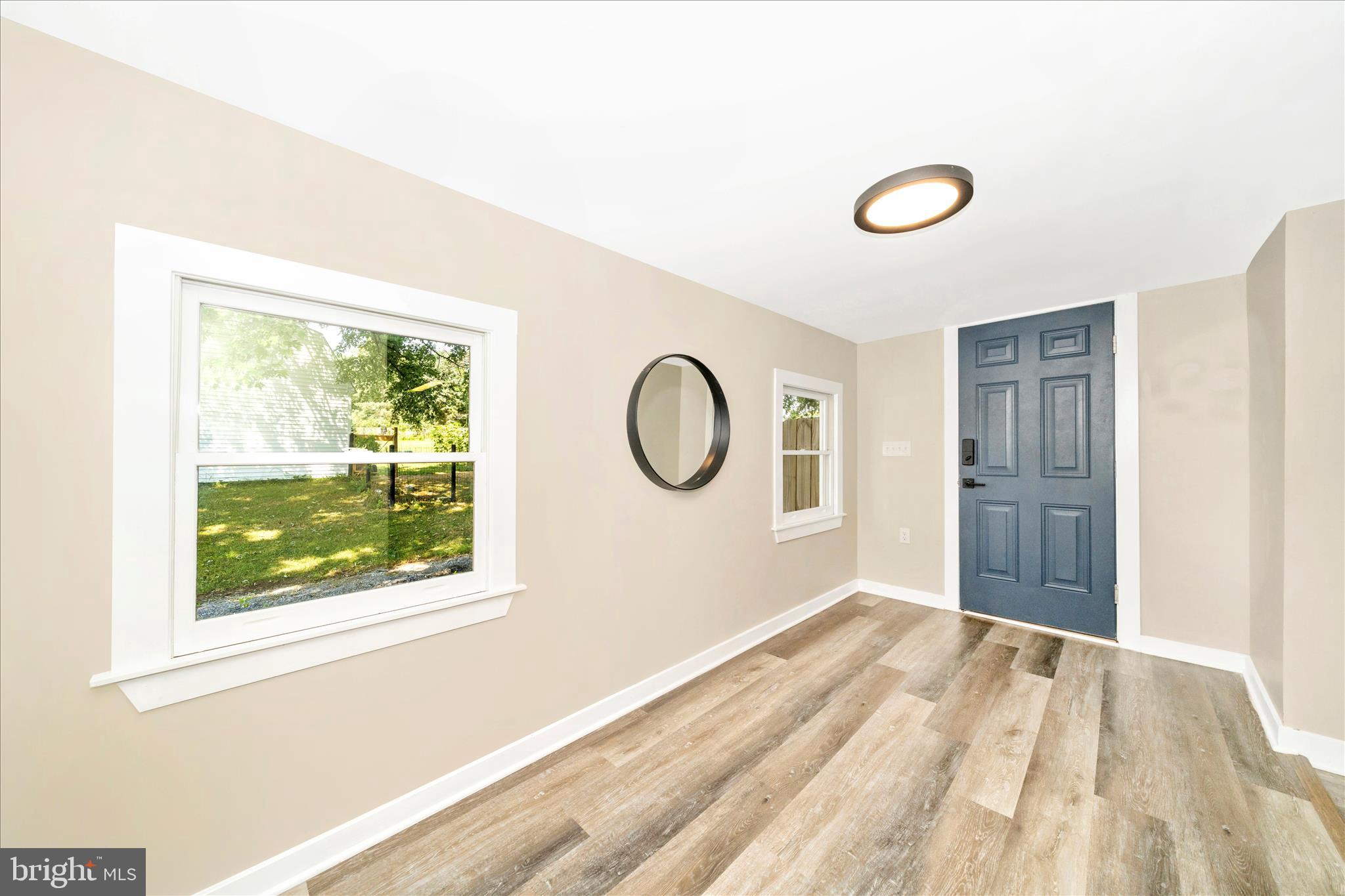 20724 Netz Road Boonsboro, MD 21713 - Photo 16 of 40 a view of a livingroom with wooden floor and window