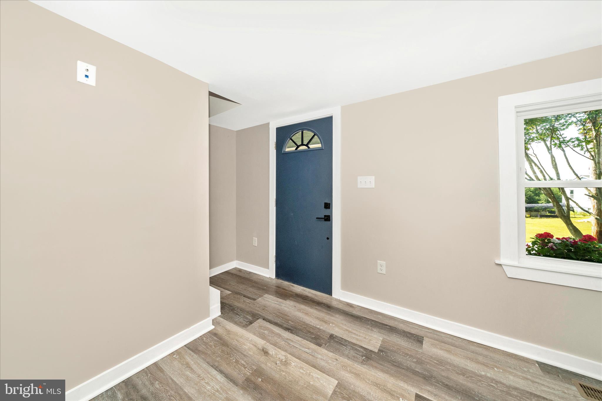 20724 Netz Road Boonsboro, MD 21713 - Photo 5 of 40 a view of an empty room with window and wooden floor
