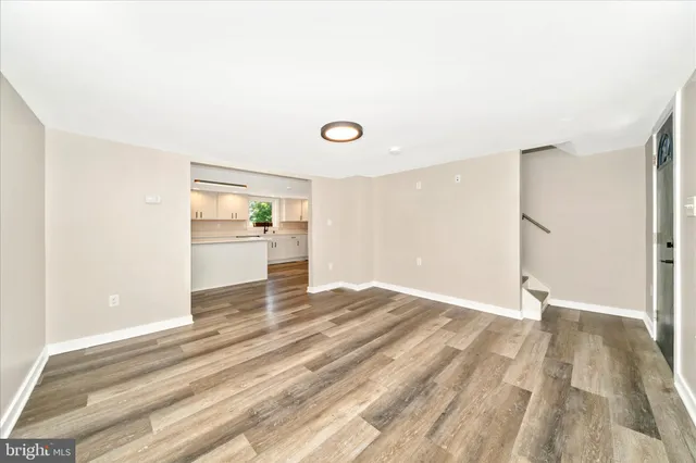 a large kitchen with stainless steel appliances granite countertop a stove a sink dishwasher and a refrigerator