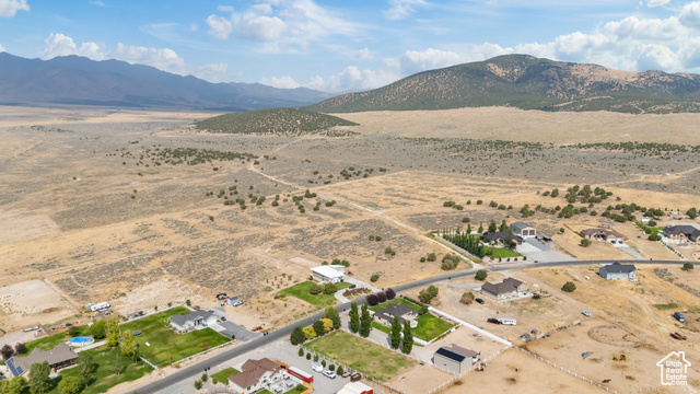 2974 West Ridgeline Road, Unit 85 Stockton, UT 84071 - Photo 18 of 23 Aerial overview of property's location featuring a mountain backdrop and rural landscape