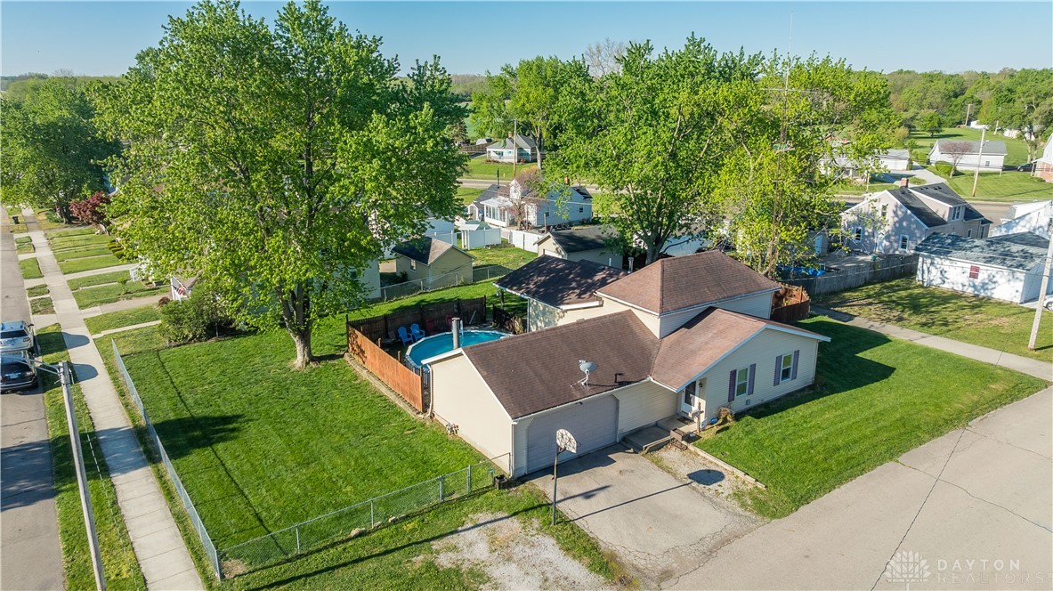 220 Racer Street Troy, OH 45373 - Photo 5 of 33 An aerial view showcases a large double lot property featuring a fenced yard and inviting above-ground pool.
