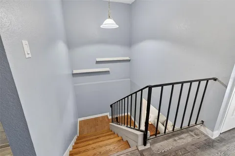 a view of staircase with white walls
