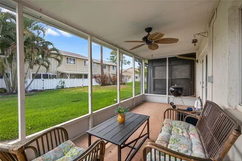 a view of a patio with a yard