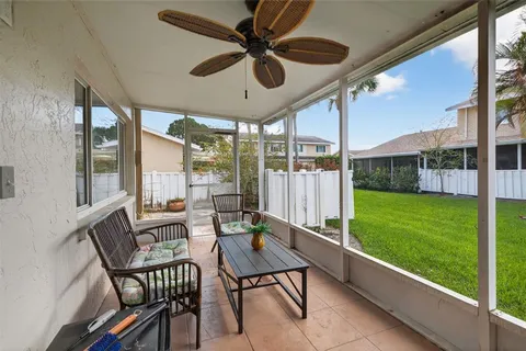 a outdoor space with chairs and a table