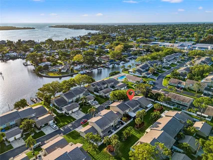 an aerial view of residential houses with outdoor space