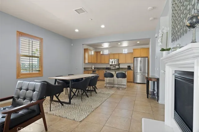 a lobby with furniture and a fireplace