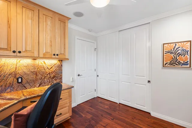 a view of room with window and wooden floor