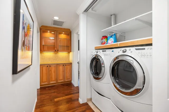 a view of a hallway with washer and dryer