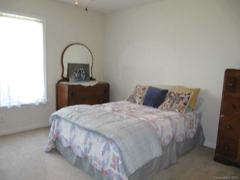 417 St Lukes Church Road Kings Mountain, NC 28086 - Photo 14 of 19 a bedroom with a bed and a dresser