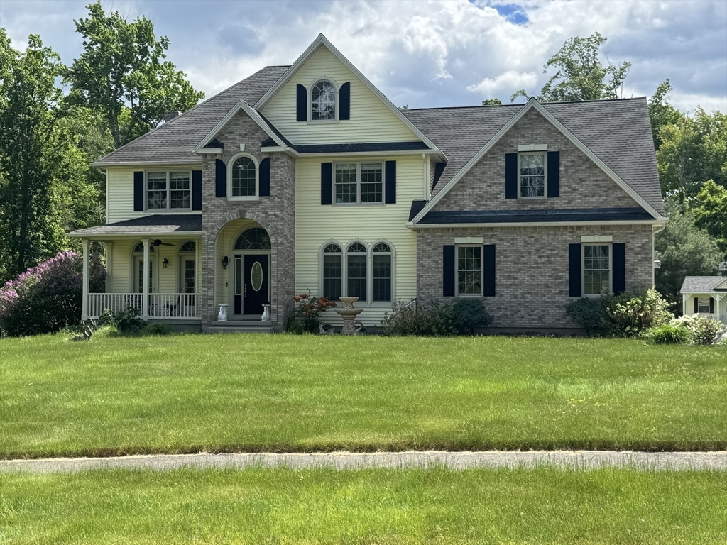 5 Gableview Lane Southwick, MA 01077 - Photo 2 of 41 a front view of a house with a garden