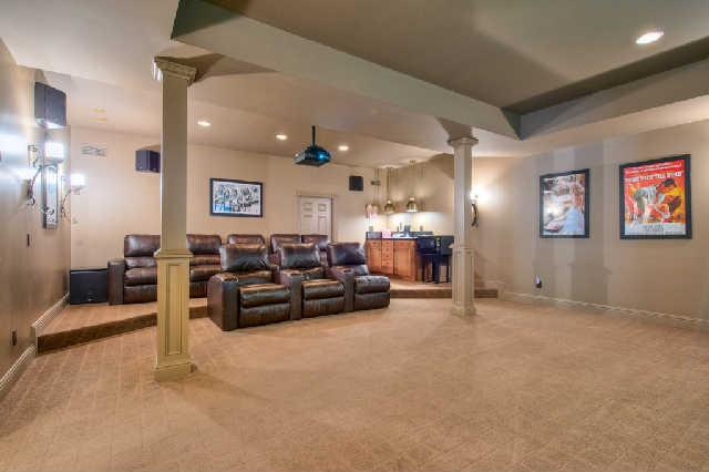 914 Overton Lea Road Nashville, TN 37220 - Photo 15 of 20 a living room with furniture and a chandelier