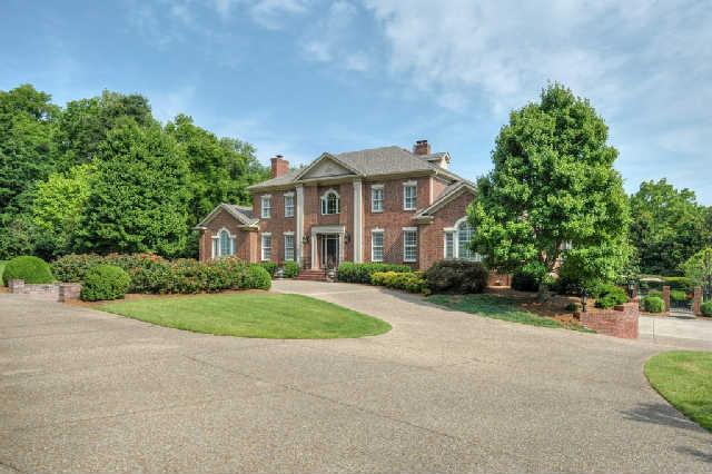 914 Overton Lea Road Nashville, TN 37220 - Photo 2 of 20 a front view of a house with a yard