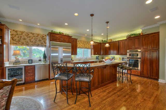 914 Overton Lea Road Nashville, TN 37220 - Photo 6 of 20 a kitchen with kitchen island a large counter top space appliances and a dining table