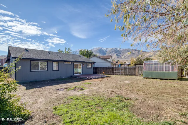 a house with trees in the background