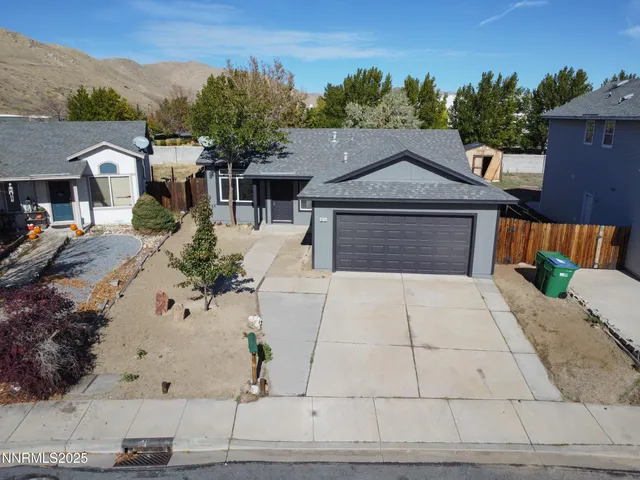 a view of kitchen and hall with wooden floor