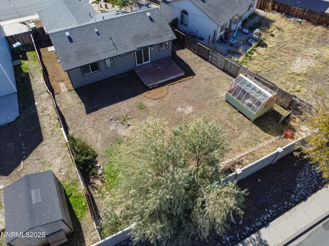 an aerial view of a house with a garden