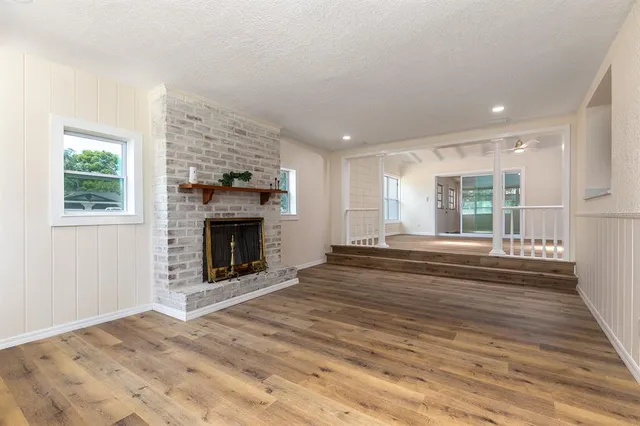 a kitchen with kitchen island a sink stainless steel appliances and cabinets
