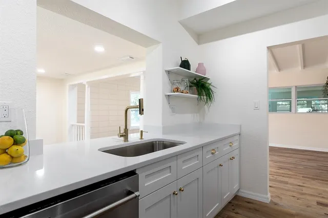 a bedroom with a large bed and a view of bathroom