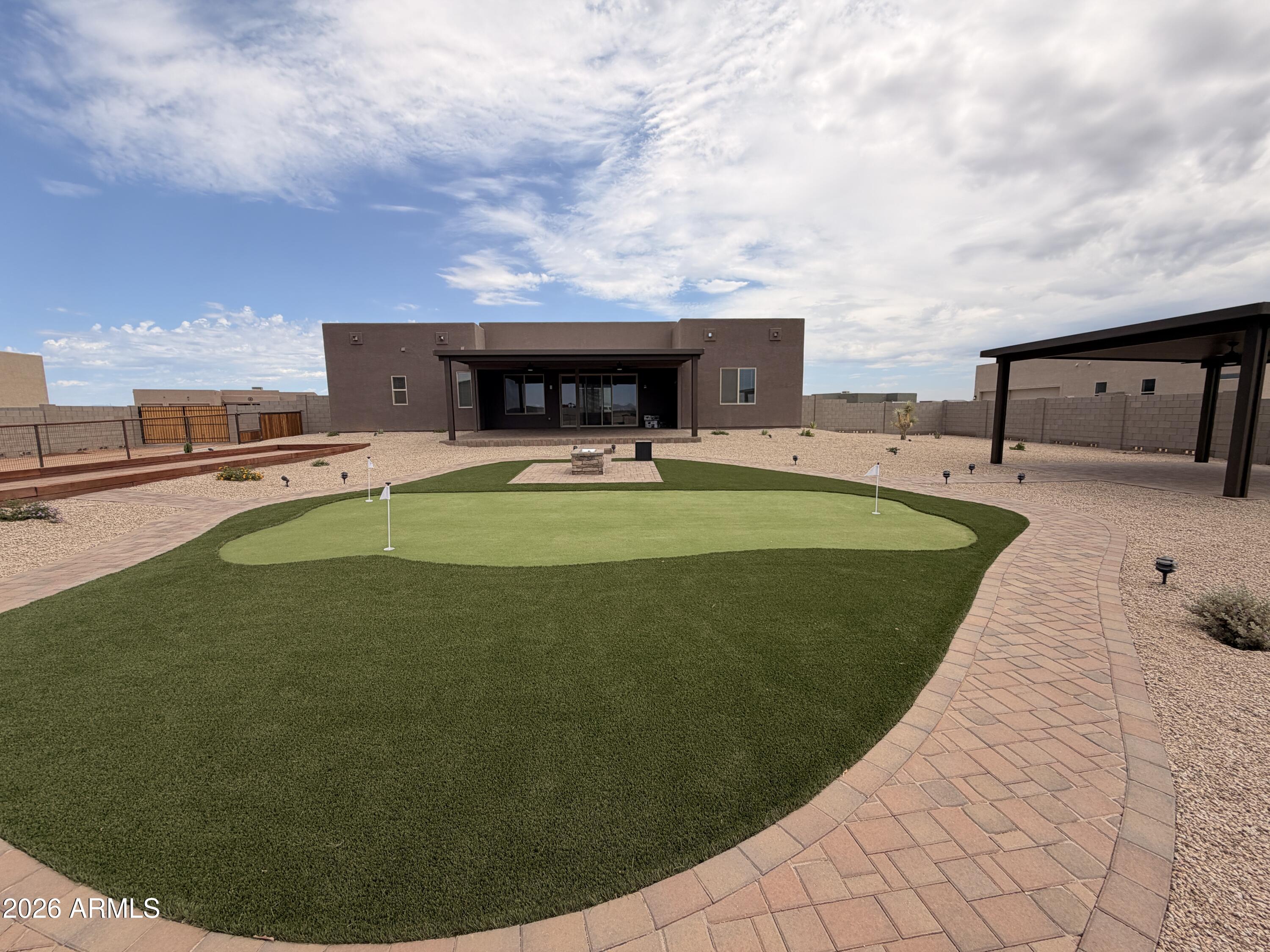 23175 West Skinner Road Wittmann, AZ 85361 - Photo 2 of 25 a view of a swimming pool with an outdoor seating