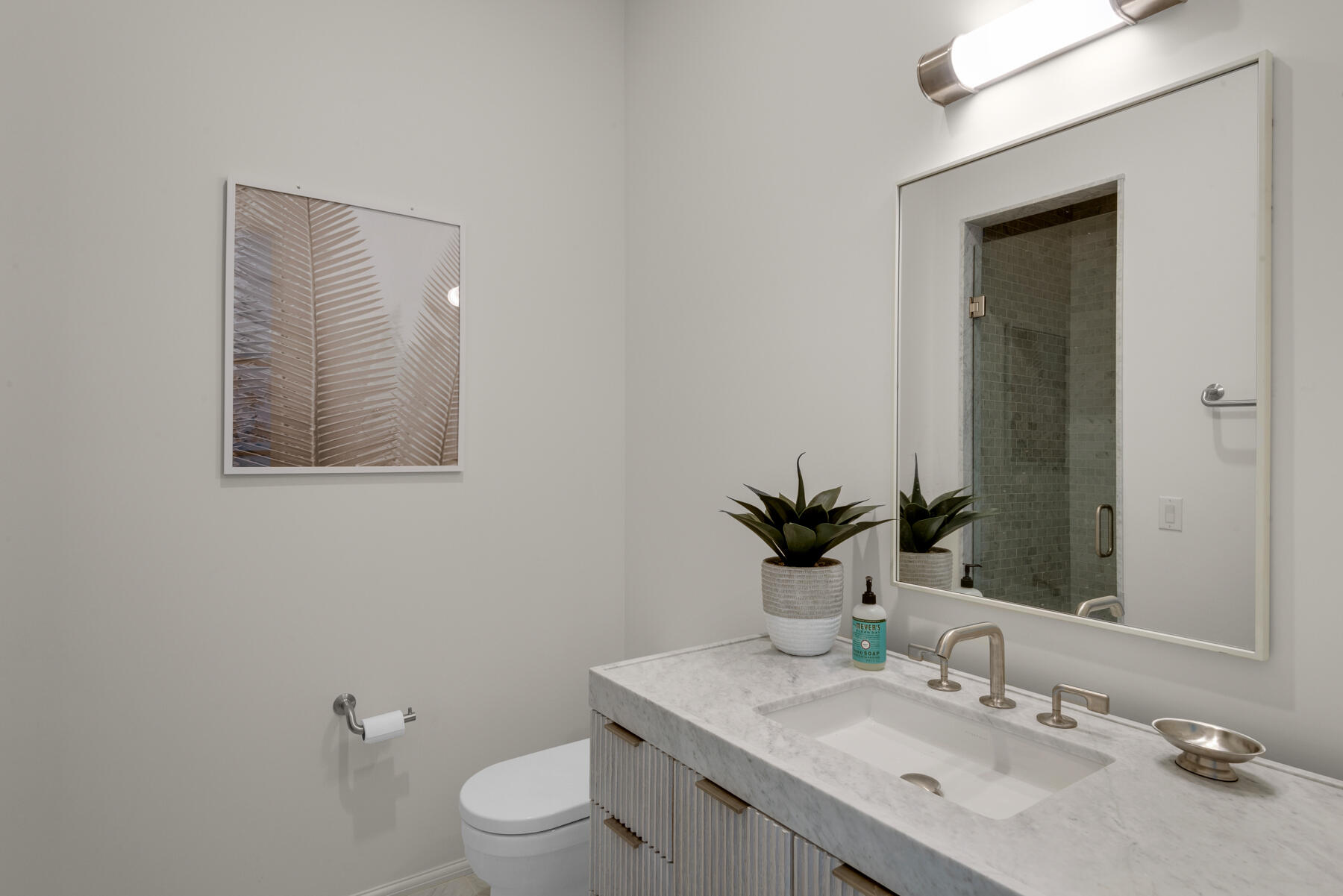 25 Stella Way Inlet Beach, Unit M 7 Inlet Beach, FL 32461 - Photo 32 of 48 a bathroom with a toilet a sink and mirror