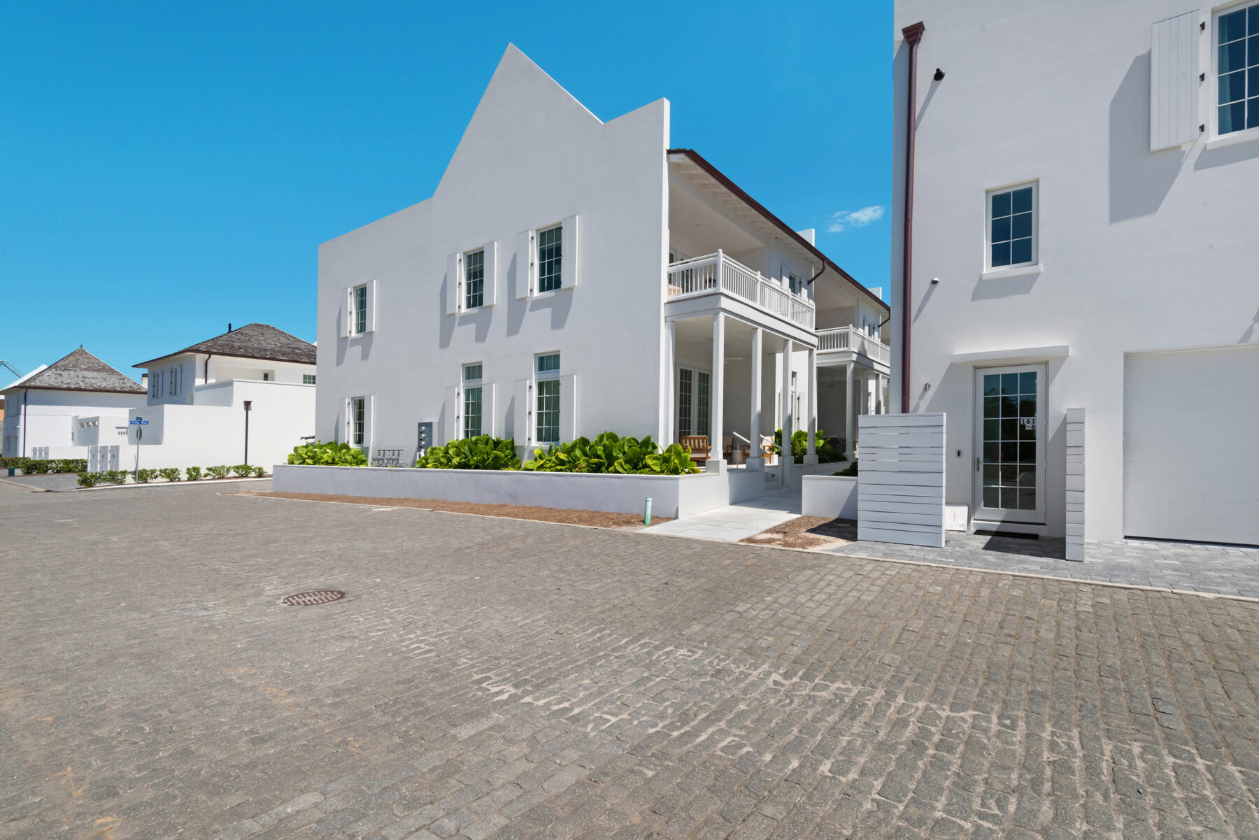 25 Stella Way Inlet Beach, Unit M 7 Inlet Beach, FL 32461 - Photo 34 of 48 a front view of a house with a yard and garage