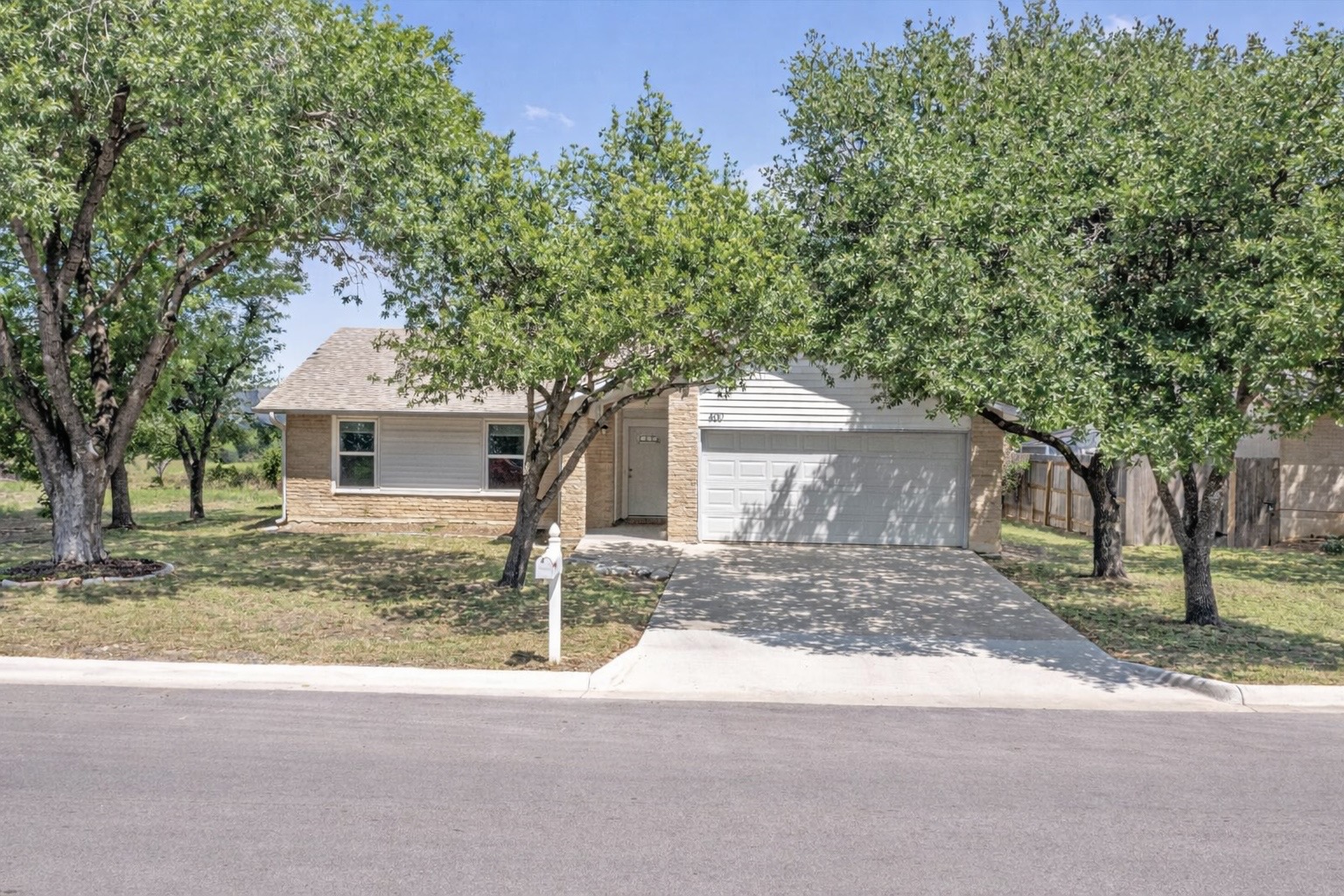 400 East Logan Street Round Rock, TX 78664 - Photo 1 of 25 a front view of a house with a yard and garage