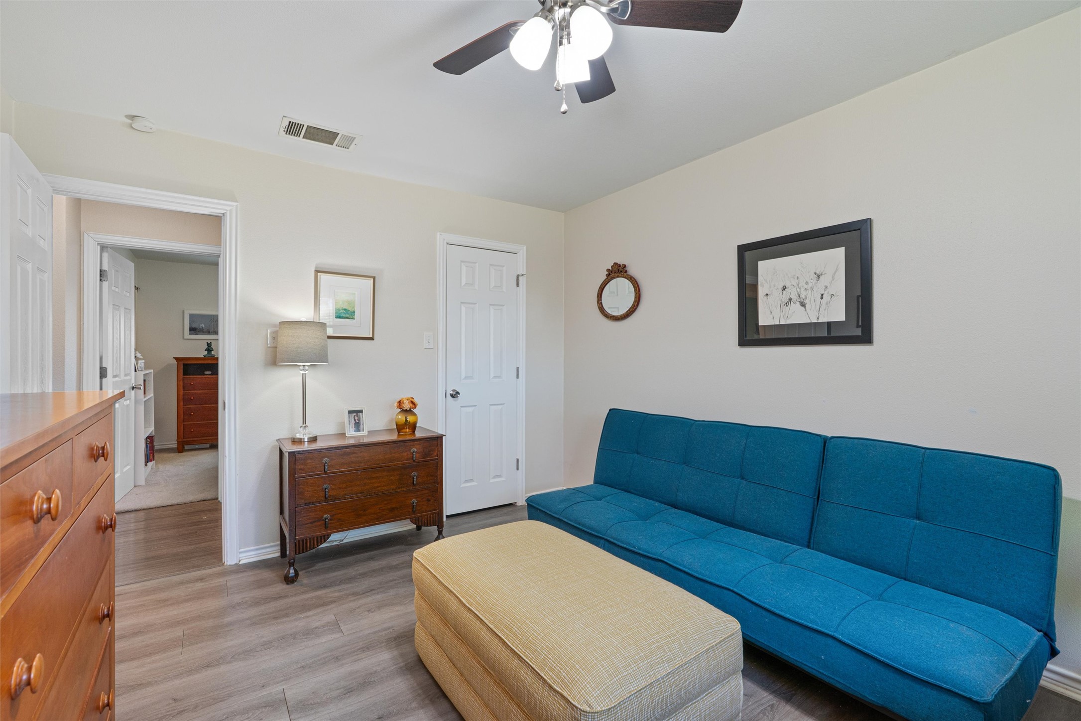 400 East Logan Street Round Rock, TX 78664 - Photo 12 of 25 a living room with furniture and a wooden floor