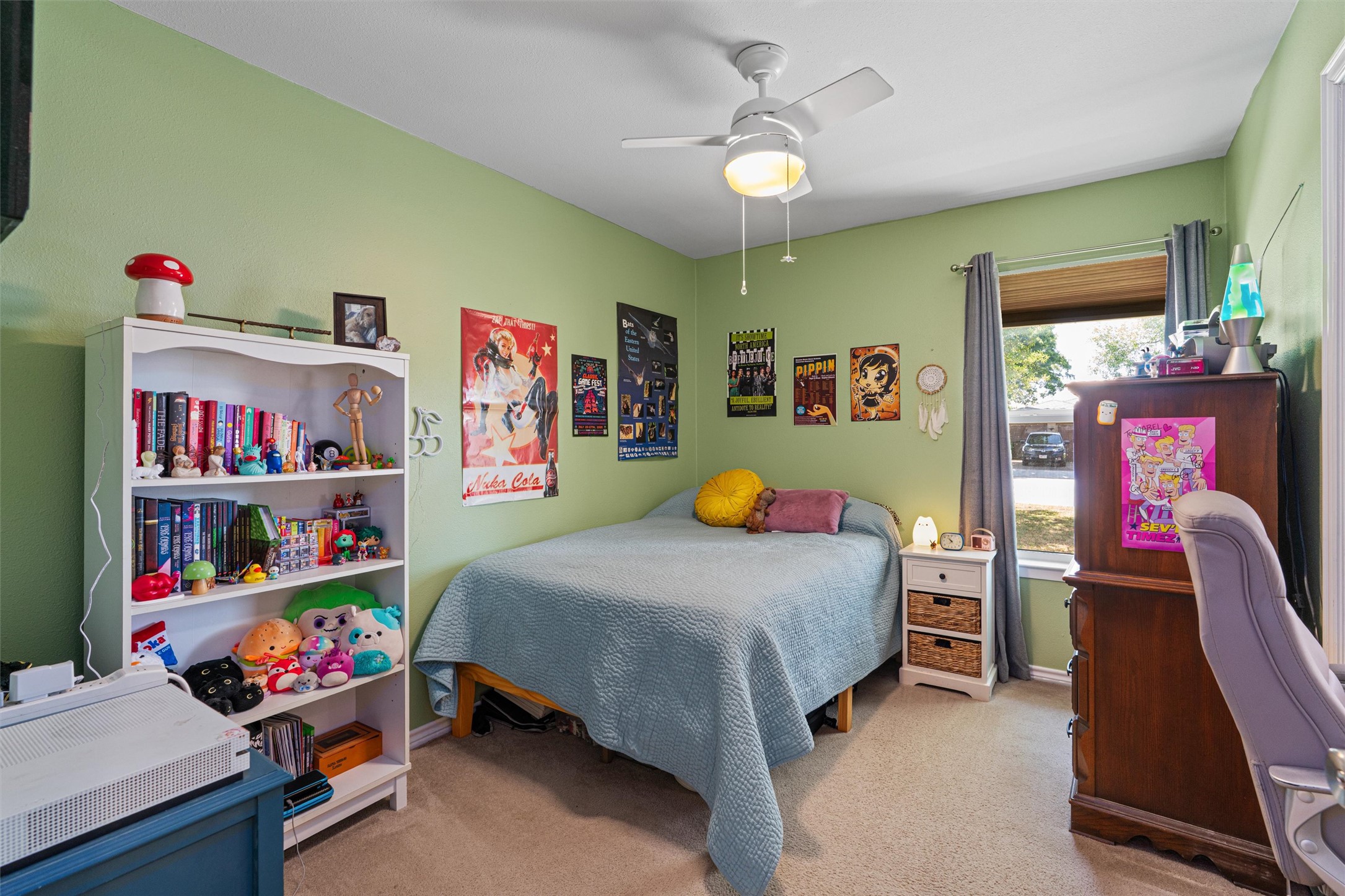 400 East Logan Street Round Rock, TX 78664 - Photo 18 of 25 a bedroom with bed and wooden floor