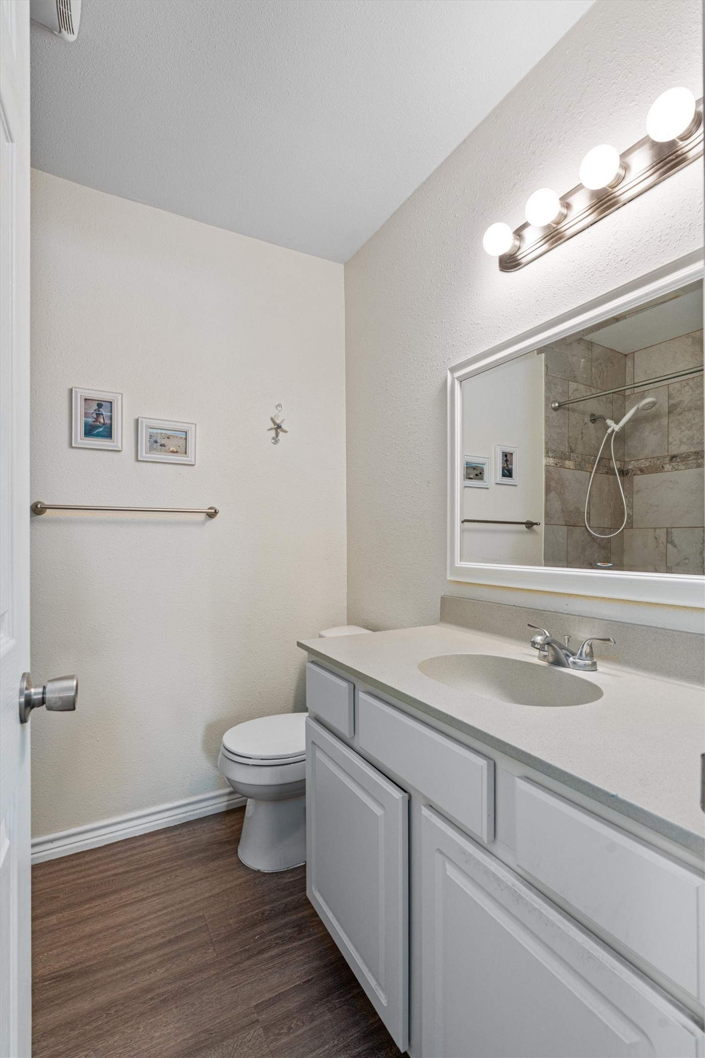 400 East Logan Street Round Rock, TX 78664 - Photo 20 of 25 a bathroom with a sink vanity mirror and toilet