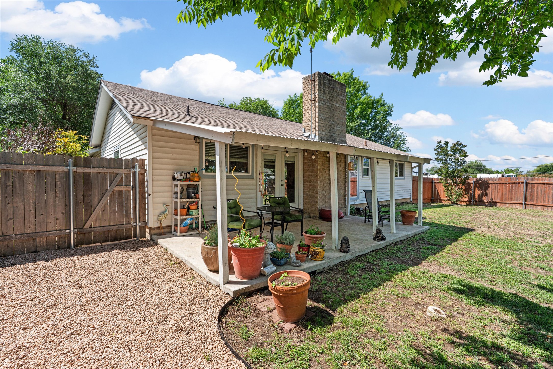 400 East Logan Street Round Rock, TX 78664 - Photo 22 of 25 a view of a house with backyard porch and sitting area