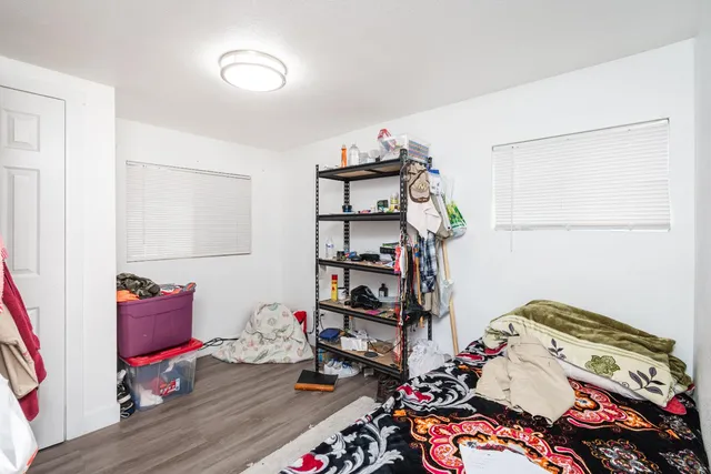 a living room with kitchen island furniture and a wooden floor