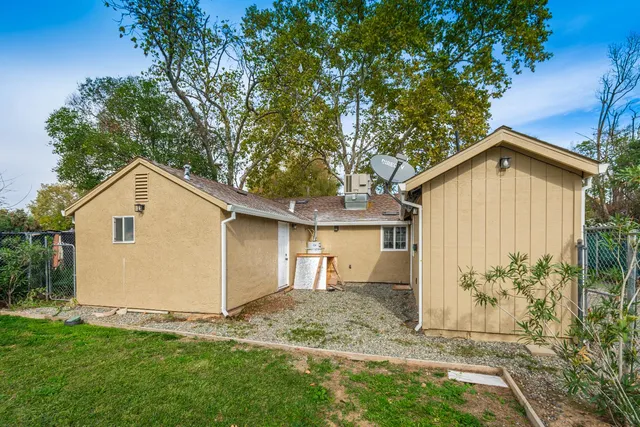 a view of a field of grass and trees