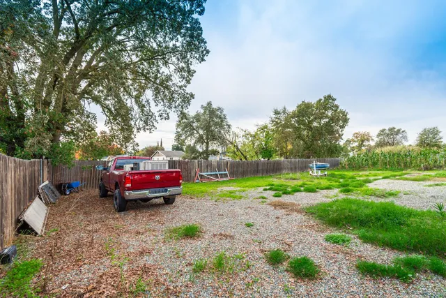 a backyard of a house with lots of green space