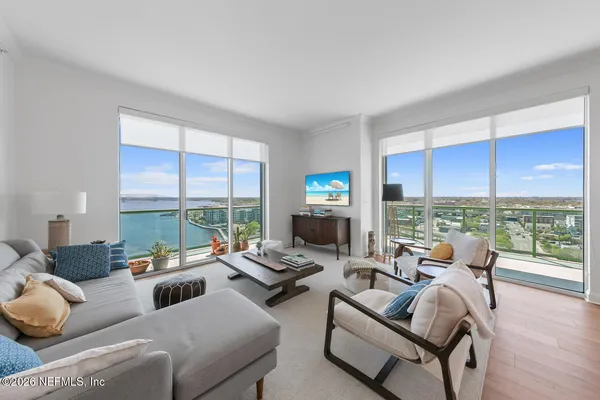 a living room with furniture and a flat screen tv