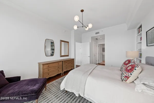 a bedroom with a bed and a dresser
