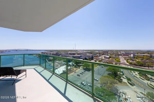 a view of a balcony with city view
