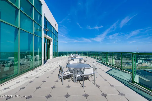 a view of a patio with a table and chairs and a couch