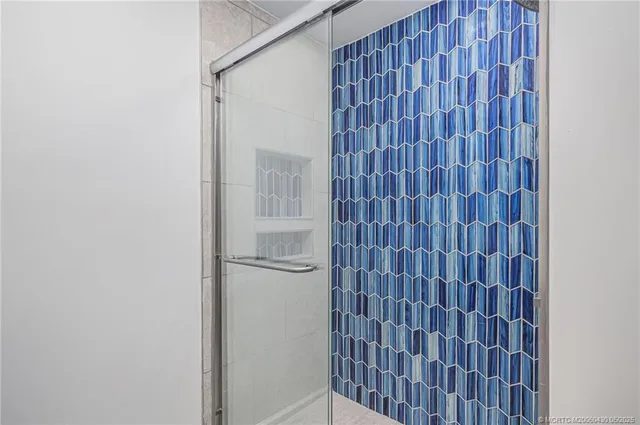 a kitchen with kitchen island a stove and a refrigerator